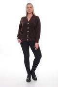 A woman modeling a dark brown button-up cardigan sweater with black leggings and black boots, standing against a plain white studio background.