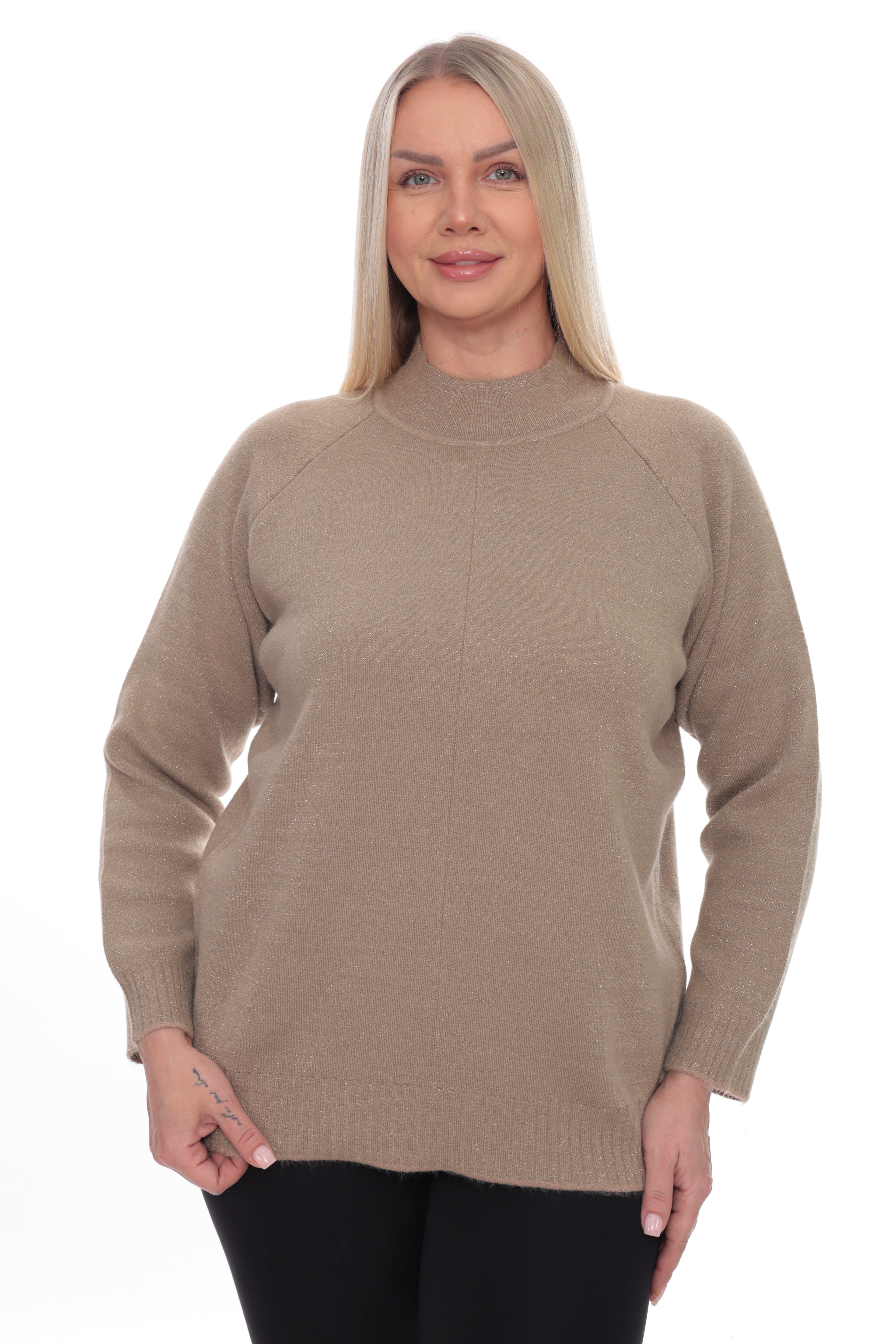 A woman modeling a taupe knit mock neck sweater against a plain white background.