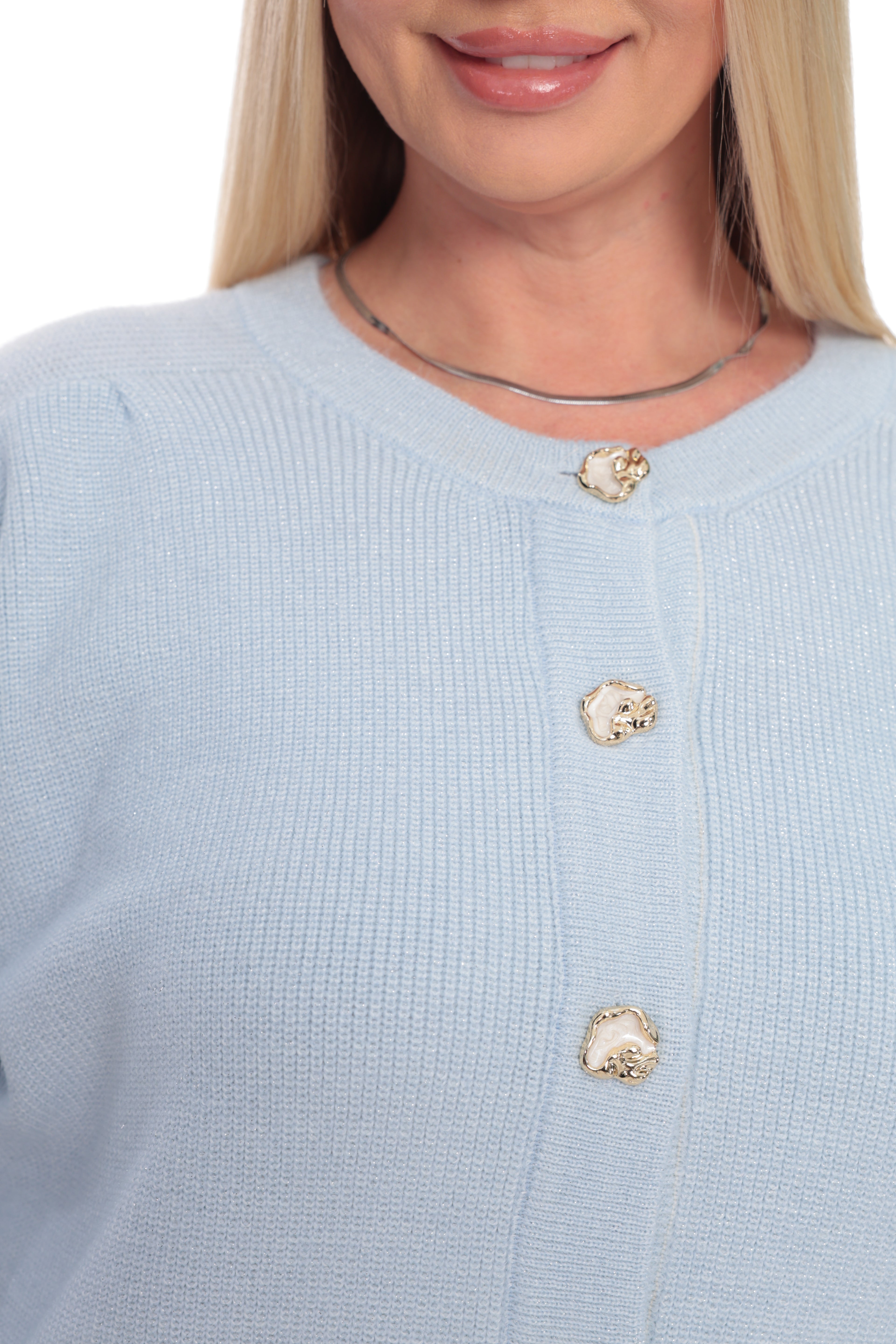 Close-up of a woman wearing a light blue ribbed knit cardigan sweater with decorative gold-toned buttons, shown against a plain white background.