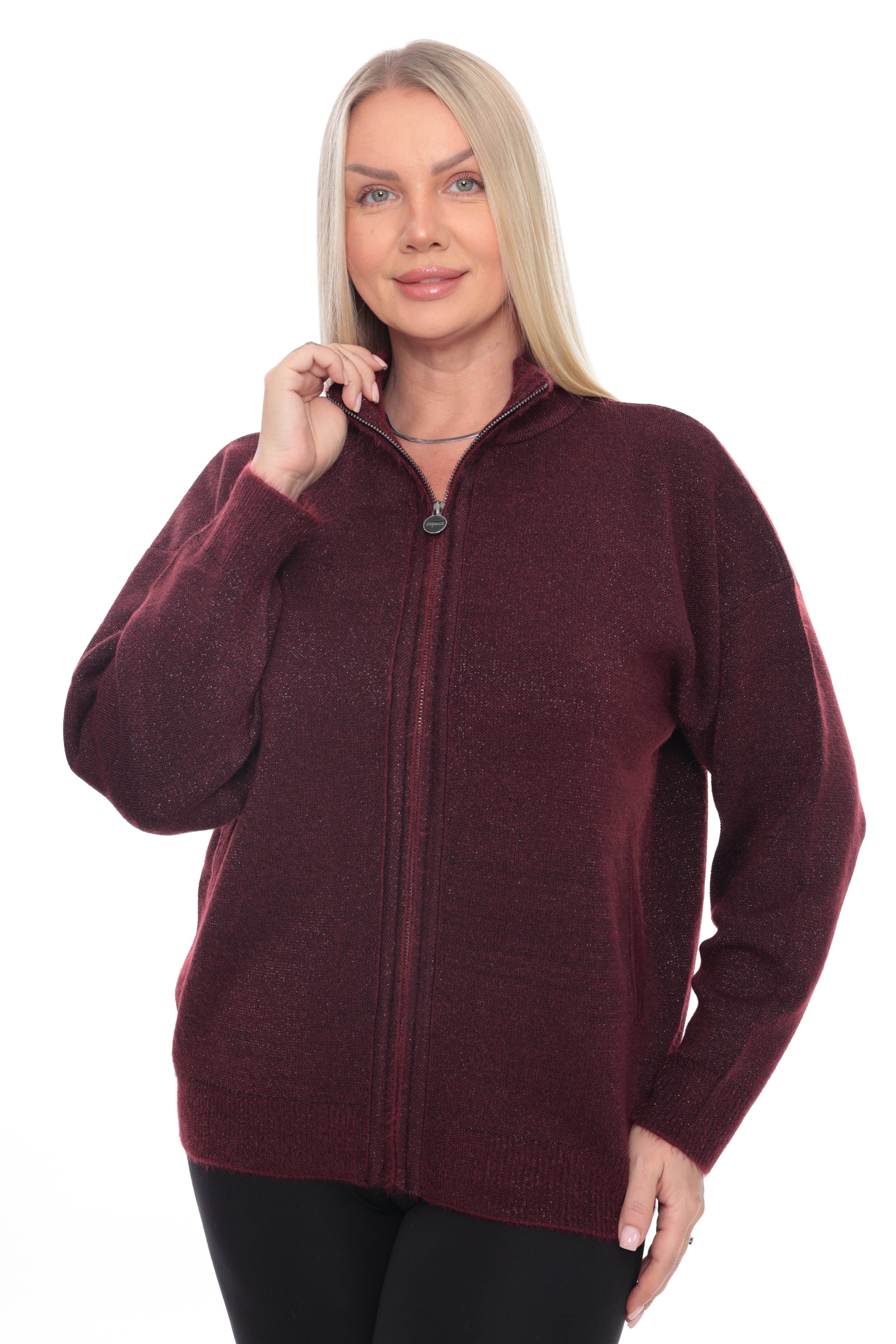 A woman modeling a heathered burgundy zip-up sweater against a plain white background.